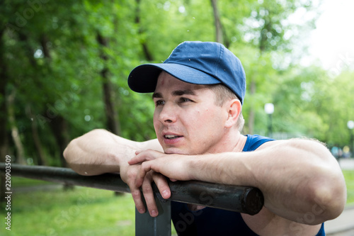 Portrait of attractive fitness man in the park