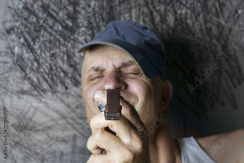 man looking at timepiece