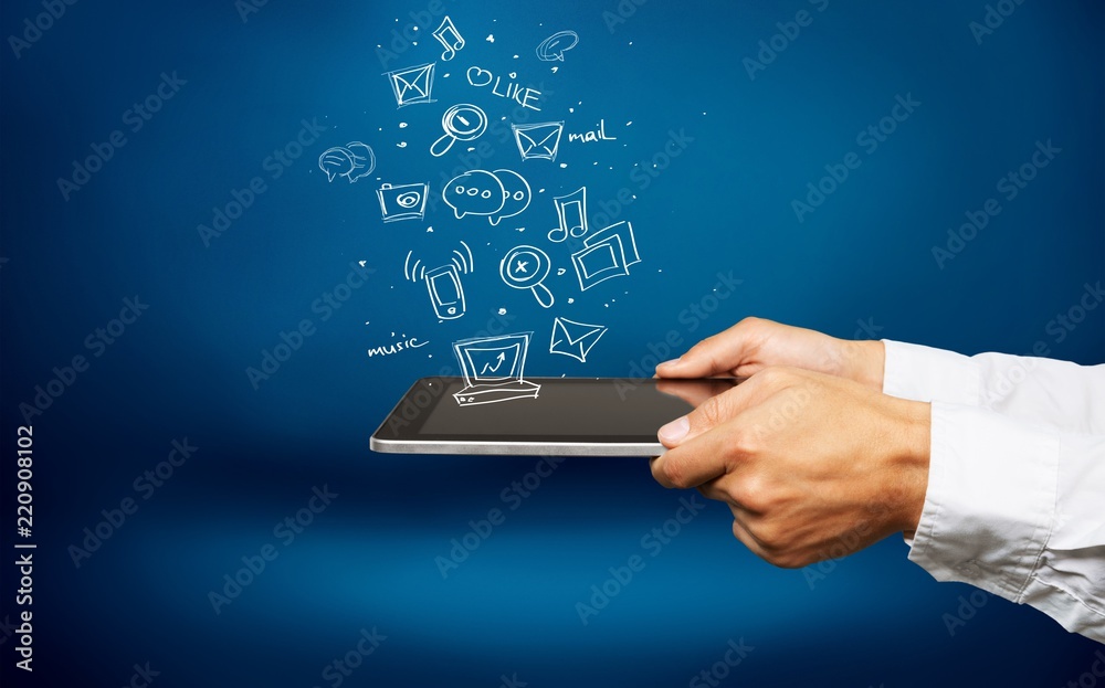 Businessman and tablet pc with abstract business icon sketches Businessman and tablet pc with abstract business icon sketches