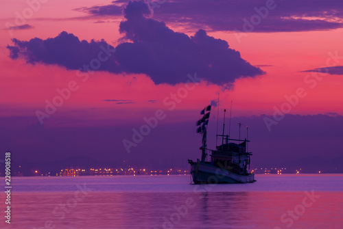 Fishing boat with sunset sky, Laem Chabang port ,Chonburi Thailand. photo