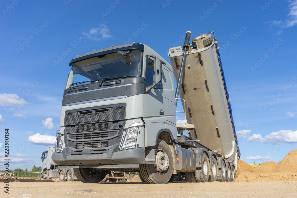 Delivery of sand to the construction site by truck