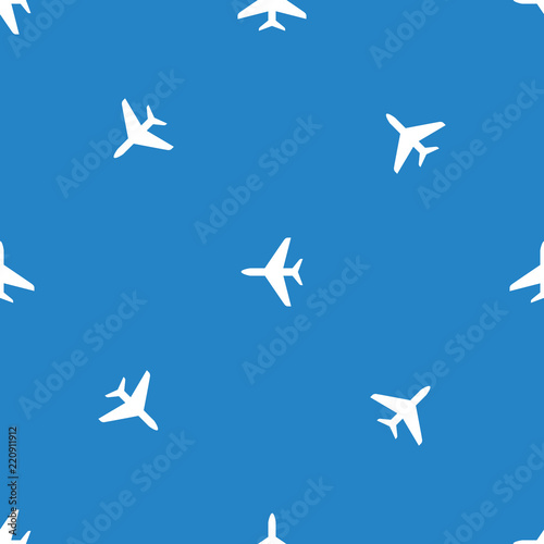 Seamless airplane pattern. Flying plane on blue background.