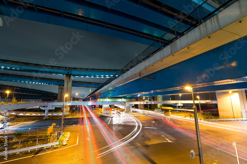 Traffic under highway at night