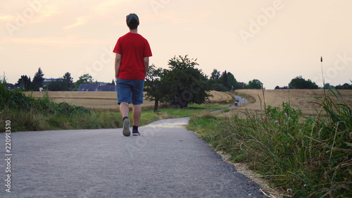 Young Depressed Man Walking Hoping To Forget Problems
