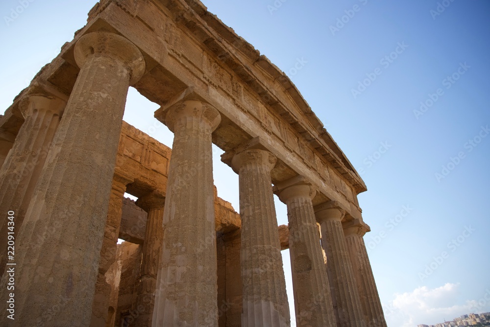 The ruins of a Greek temple with the columns still erected at sunset in the Valley of the Temples (Valle dei Templi) in Agrigento in Sicily