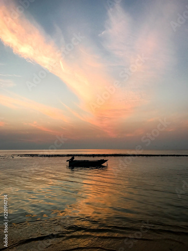 Boat on the water at sunset sunrise