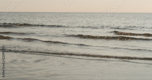 Fototapeta Naklejka Na Ścianę i Meble -  waves on a beach on a windy sunny day