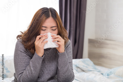 Women have sneezing because of colds