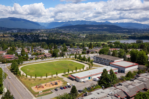 Aerial view of the modern city during a vibrant summer day. Taken in Burnaby, Greater Vancouver, BC, Canada. photo