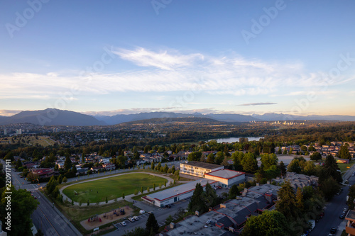 Aerial view of the modern city during a vibrant summer sunset. Taken in Burnaby, Greater Vancouver, BC, Canada.
