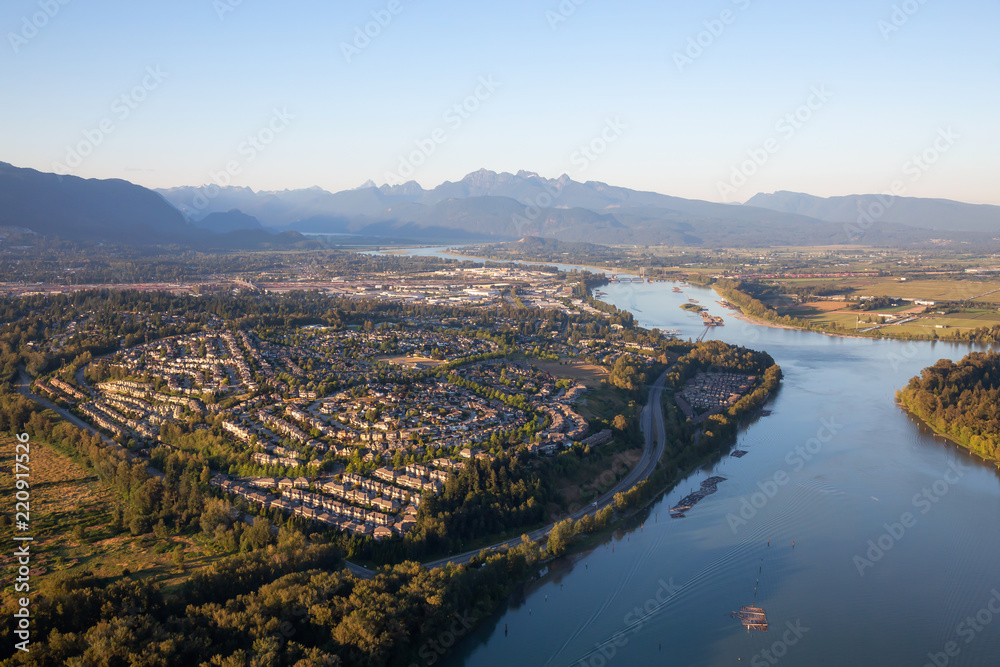 Aerial view of residential neighborhood in Port Coquitlam during a sunny summer sunset. Taken in Vancouver, BC, Canada.