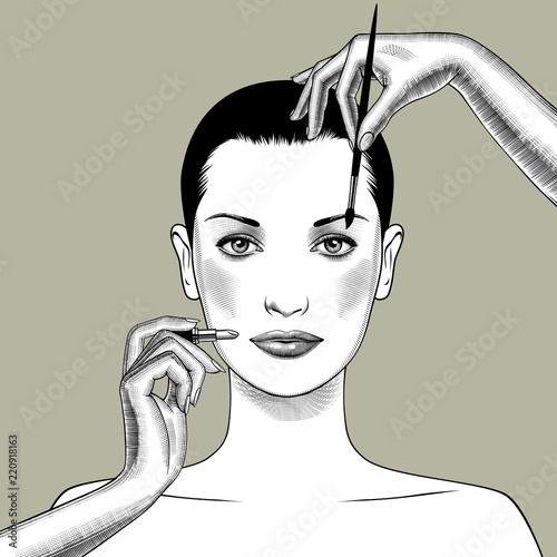 Female hands with a lipstick and brush make up a woman face