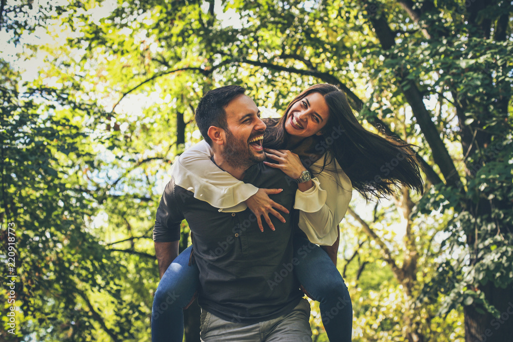 Couple at public park have fun together. Moving activity. Couple at public park have fun together. Moving activity.