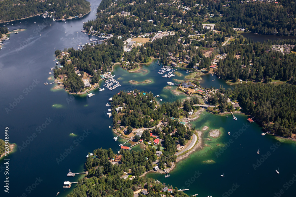 Aerial view of Madeira Park during a sunny summer day. Taken in Sunshine Coast, BC, Canada.