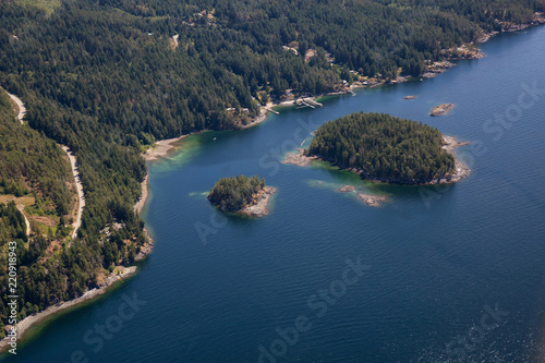 Aerial view of Rocky Islands near Madeira Park during a sunny summer day. Taken in Sunshine Coast, BC, Canada. photo