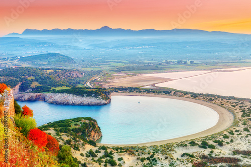Fine beaches of Greece, Messinia. Amazing sunrise panoramic view of Voidokilia beach, one of the best beaches in mediterranean Europe, beautiful lagoon of Voidokilia from above. Vacations background. photo
