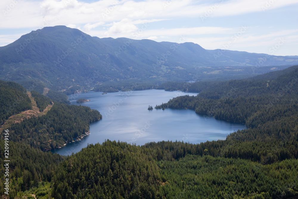 Aerial view of Ruby Lake during a sunny summer day. Taken in Sunshine Coast, BC, Canada.