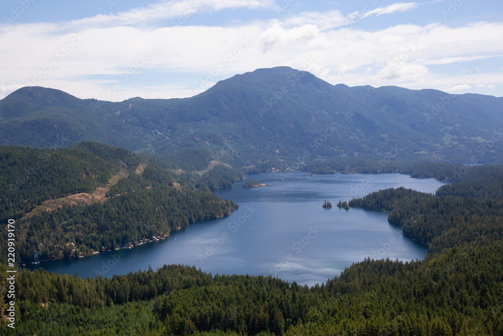 Aerial view of Ruby Lake during a sunny summer day. Taken in Sunshine Coast, BC, Canada.