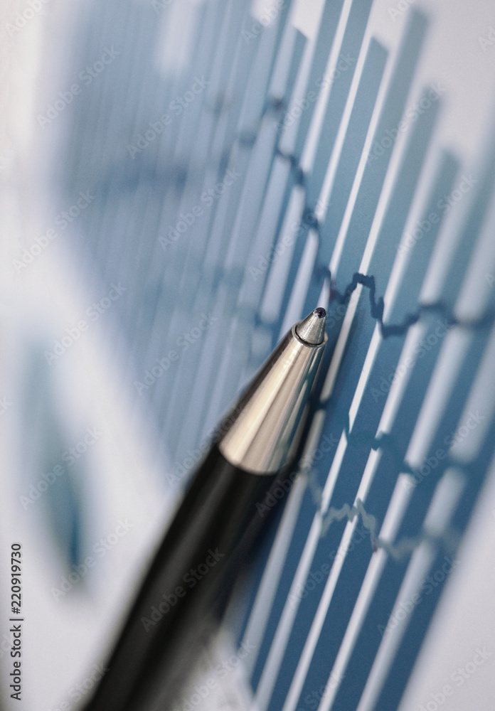 close up. blurred image pen and financial chart