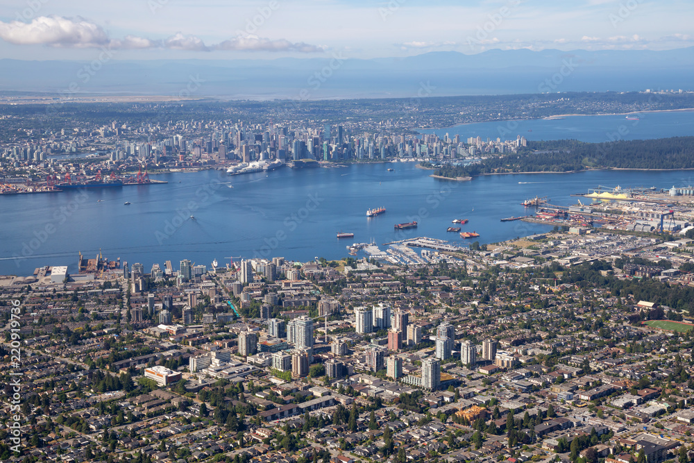 Aerial view of North Vancouver, BC, with Downtown City in the Background.