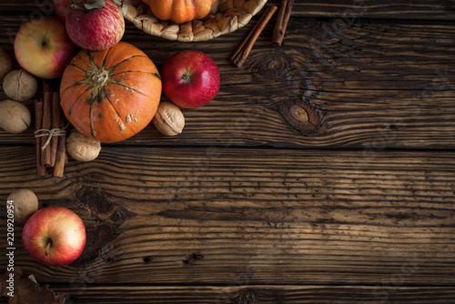 Autumn apples, pumpkin and cinnamon sticks