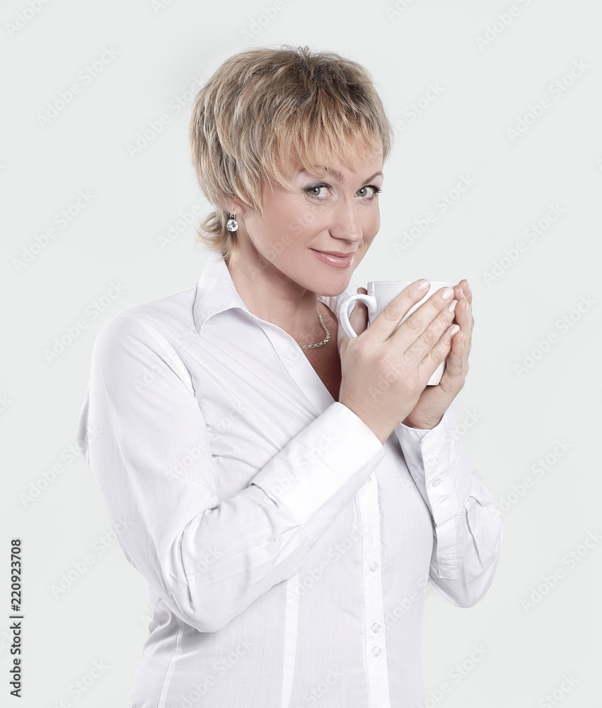 closeup. beautiful business woman with a Cup of coffee closeup. beautiful business woman with a Cup of coffee