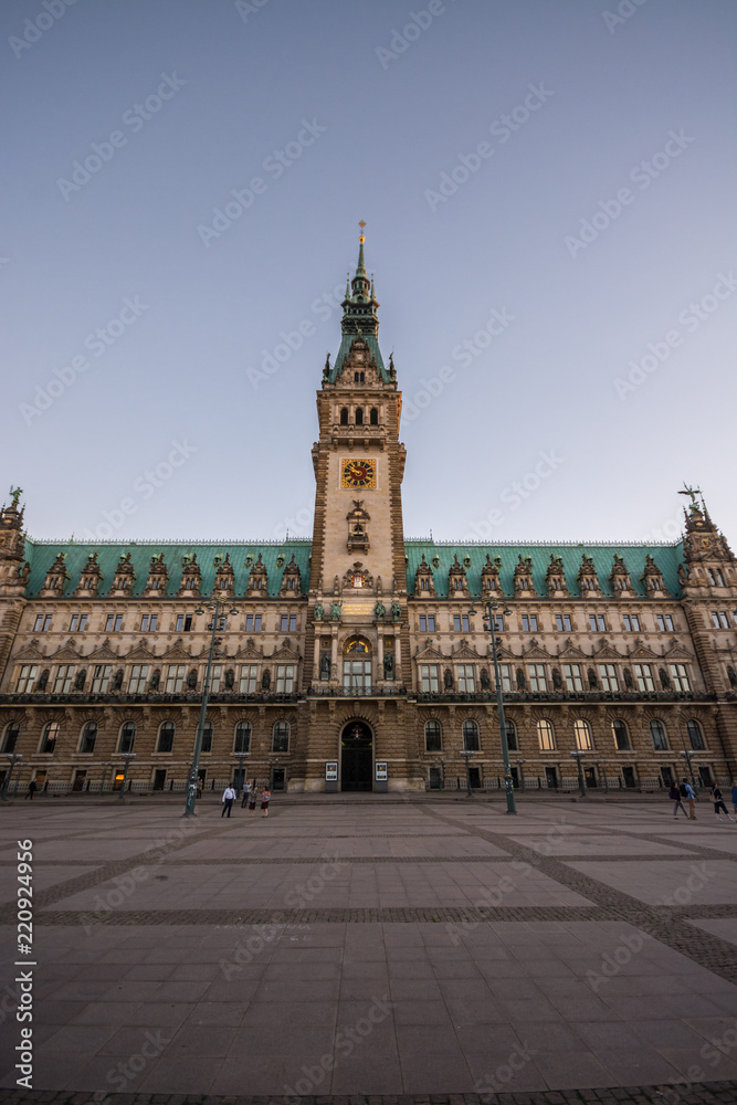 Hamburg City Hall is the seat of local government of the Free and Hanseatic City of Hamburg, Germany. Sunset.