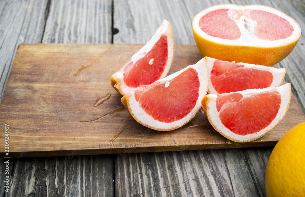 chopped citrus lobules against a tree background