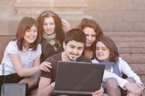 closeup. groups of students with a laptop