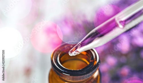 Quadro su tela Pile of lavender flowers and a dropper bottle with lavender