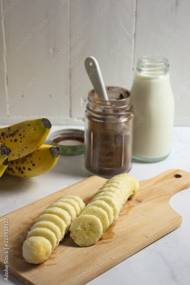Making banana milk shake with carob and cocoa Making banana milk shake with carob and cocoa