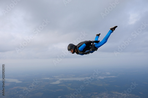 Skydiving. Girl is in the sky. photo