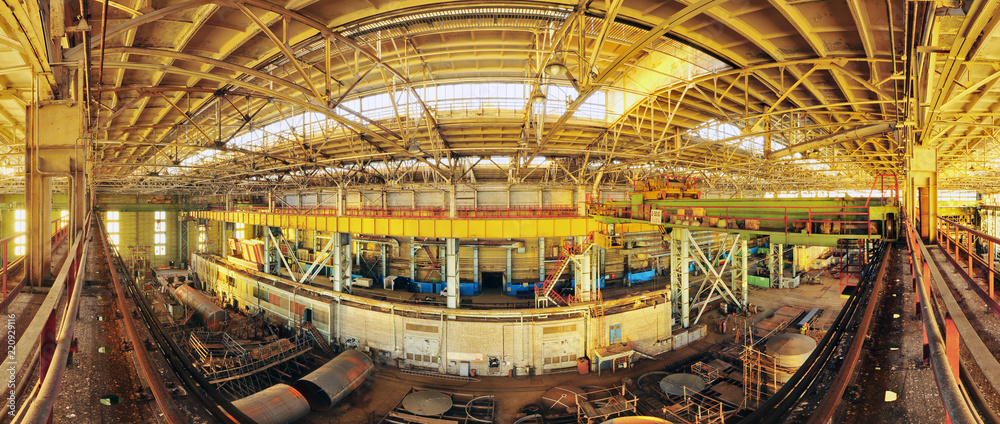 Obraz premium Abandoned plant in sunset light. Panorama 180 degrees.