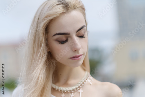 Portrait of a young sensual woman at sunny day.