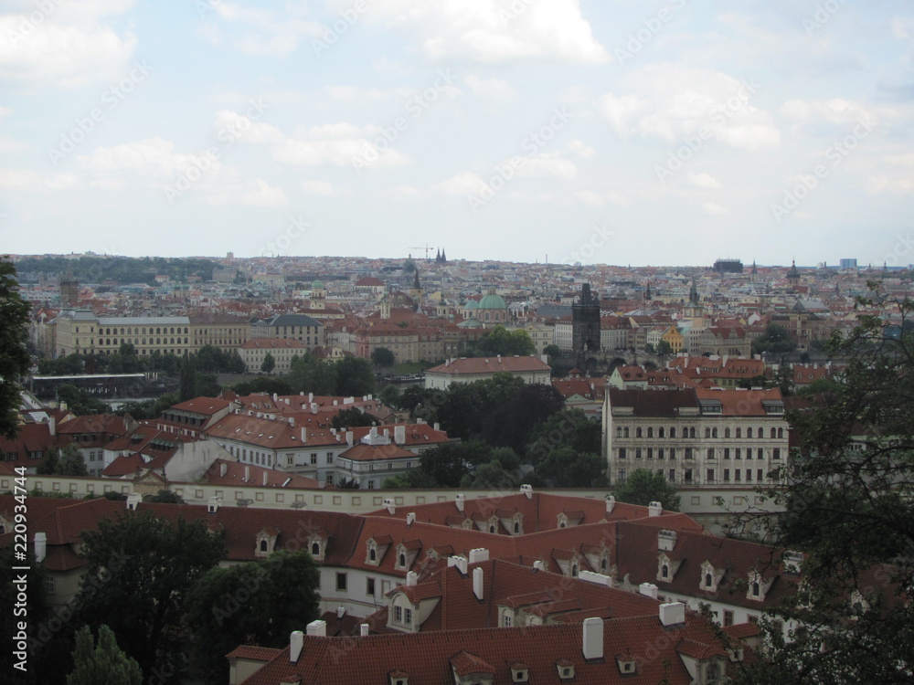 Panorama of Prague, view of the city roofs and domes of churches