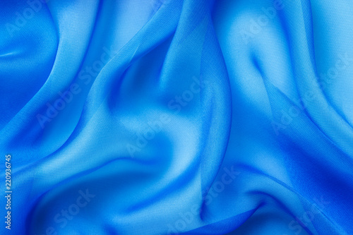 light blue fabric with large folds abstract background