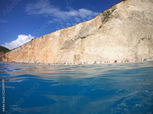 Sea level underwater photo of tropical caribbean paradise turquoise beach in exotic island located in an ocean