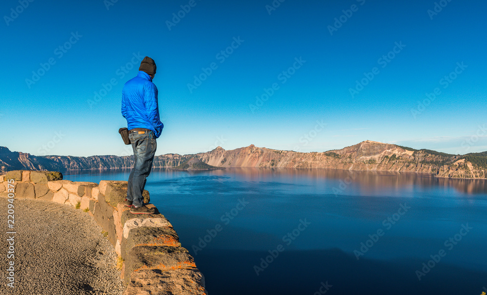 scenic view of a man stand over look to Crater lake National park,Oregon,usa.