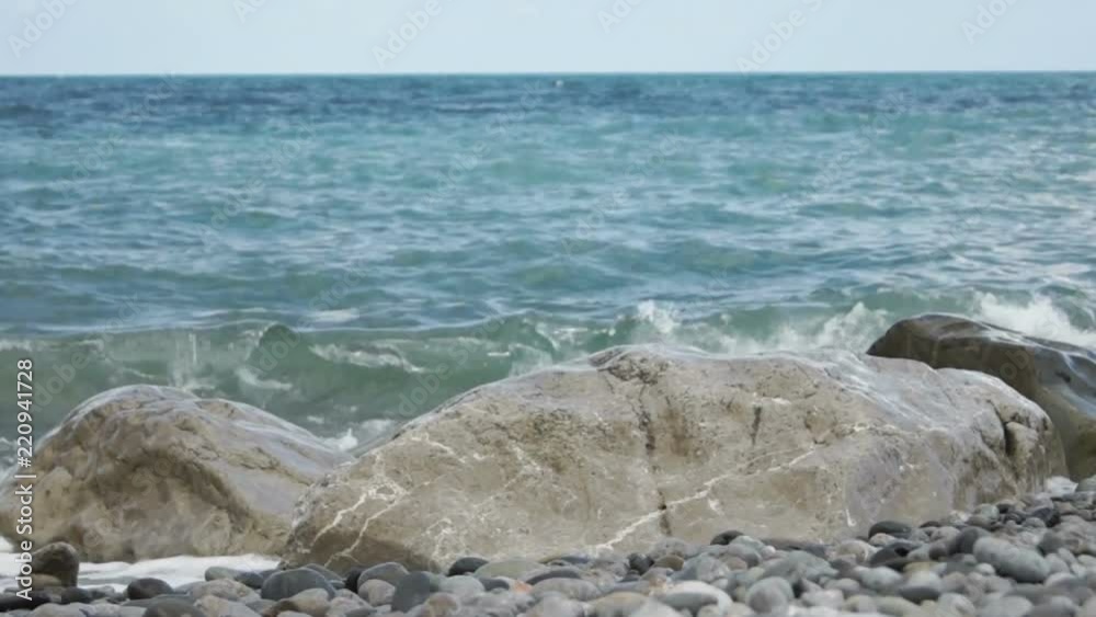 Beautiful blue sea with stony shore Beautiful blue sea with stony shore