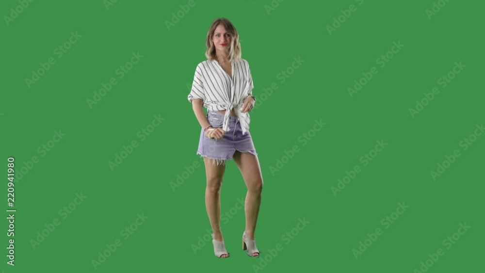 Full body length green screen isolate playful fashionable woman posing and smiling Full body length green screen isolate playful fashionable woman posing and smiling