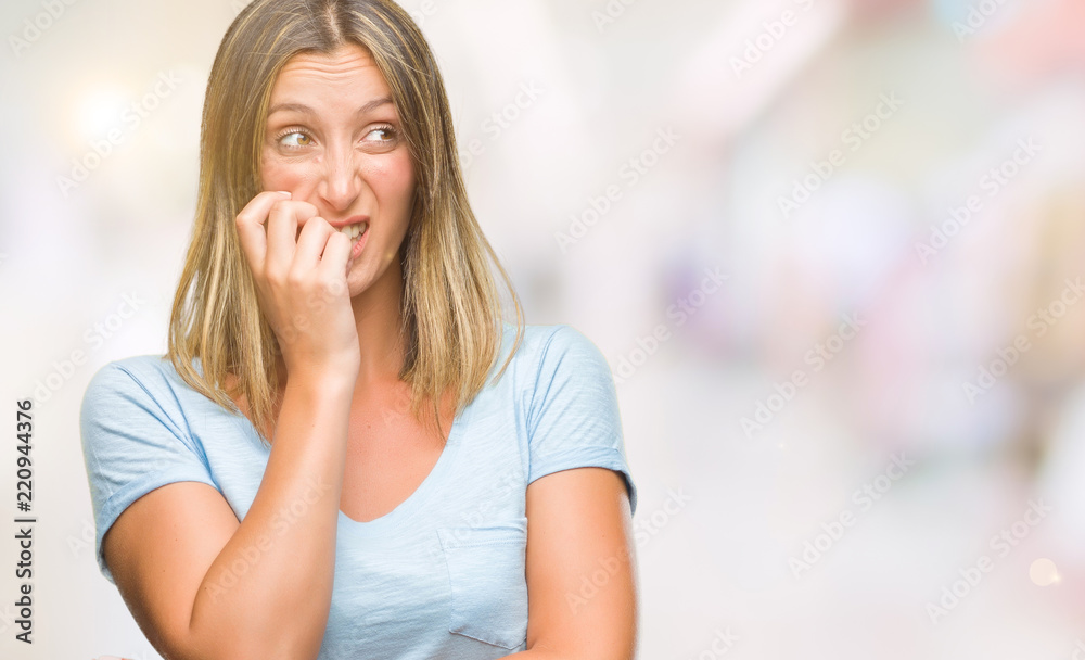 Obraz premium Young beautiful woman over isolated background looking stressed and nervous with hands on mouth biting nails. Anxiety problem.