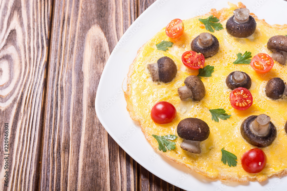 Omelette with mushroom , tomato and parsley Omelette with mushroom , tomato and parsley