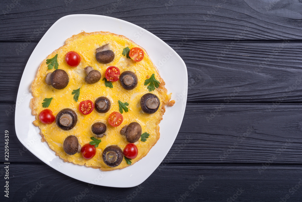 Omelette with mushroom , tomato and parsley Omelette with mushroom , tomato and parsley