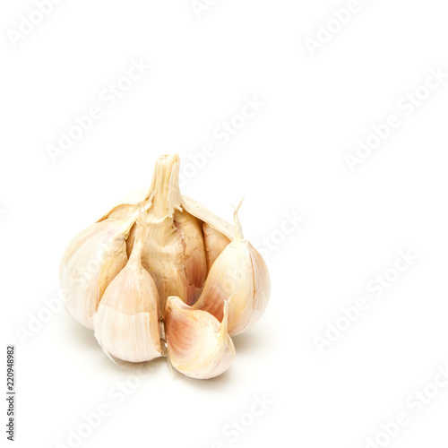 Raw garlic on white.