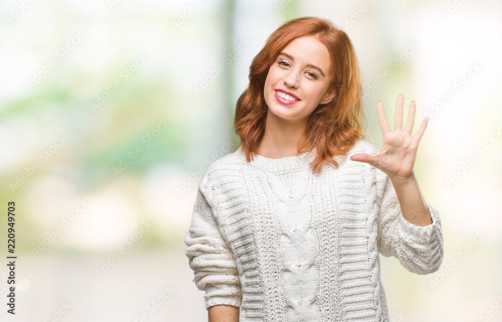 Young beautiful woman over isolated background wearing winter sweater showing and pointing up with fingers number five while smiling confident and happy. Young beautiful woman over isolated background wearing winter sweater showing and pointing up with fingers number five while smiling confident and happy.