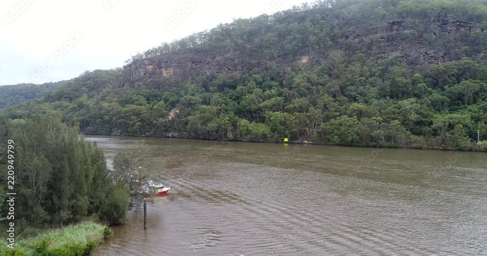 Vehicle ferry off-loading cars at the ramp of Wiseman ferry town on Hawkesbury river – landing down to the shore.
Vehicle ferry off-loading cars at the ramp of Wiseman ferry town on Hawkesbury river – landing down to the shore.