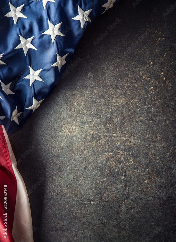 Naklejka premium American flag on dark concrete with free space.