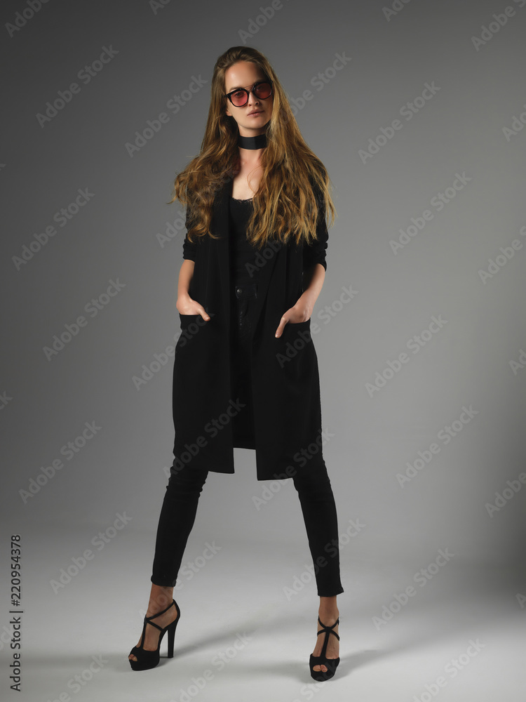 Attractive long hair beautiful woman model standing posing. Attractive long hair beautiful woman model standing posing.