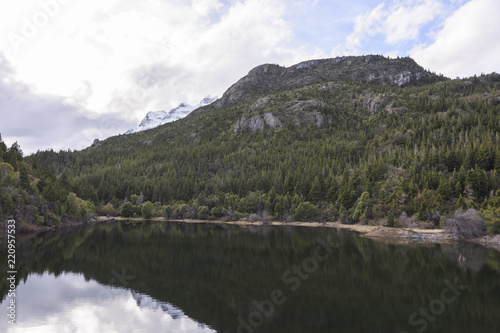 Scenic View Of Lake Reflected Against Forest