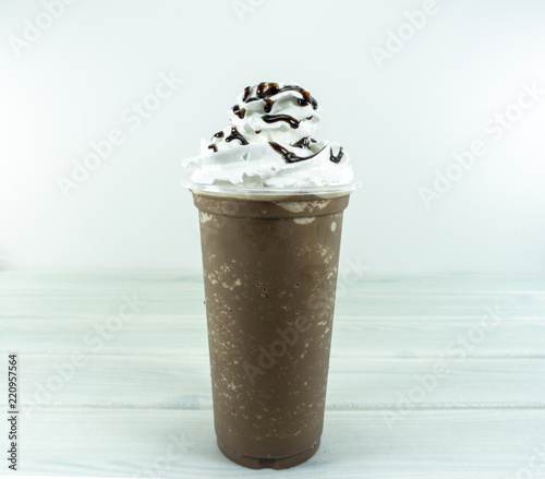 Water mold Cocoa Blend  in takeaway cup topped whip cream  chocolate isolated on white background,Front view. photo
